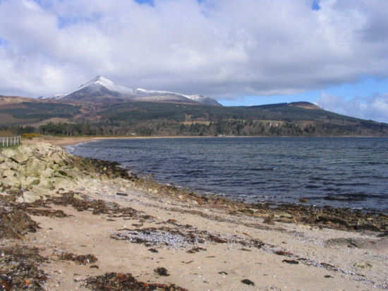 A snow-capped Goatfell from Brodick beach. 