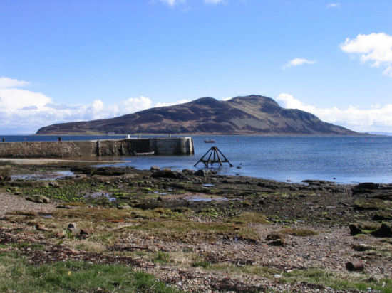 The Holy Isle from Lamlash, with the pier in the middle.