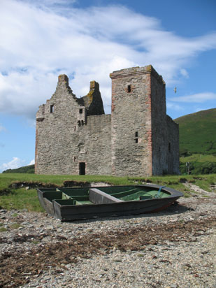 Picture of   Lochranza Castle with small boat infront of it is shown on this page.
