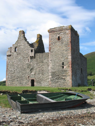 Picture of   The two small boats near Lochranza castle is shown on this page.