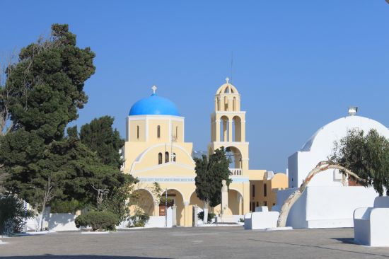 Picture of the  Large Yellow Church With Blue Dome - Oia, Santorini, Greece