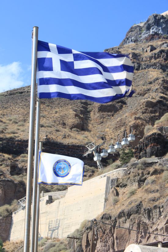 Picture of the  Greek Flag Against Cablecar  - Fira, Santorini, Greece