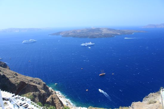 Picture of the  Nea Kamani Island And Cruise Ships  - Fira, Santorini, Greece