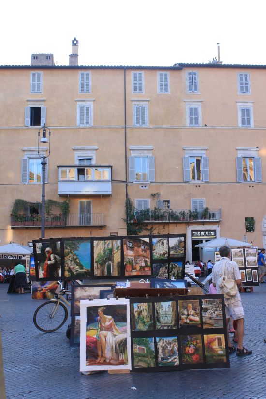   Paintings Against Pink Houses At Piazza Navona   - Rome, Italy