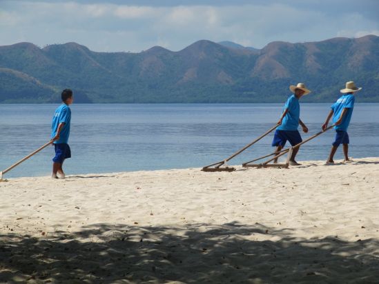 club paradise coron philippines beach raking picture