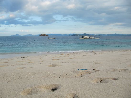 club paradise coron philippines footsteps in sand landscape picture