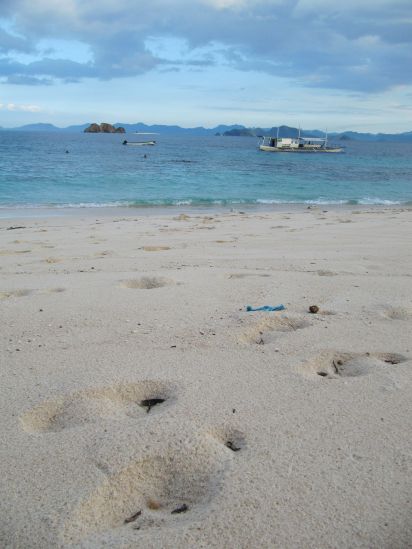club paradise coron philippines footsteps in sand portrait picture