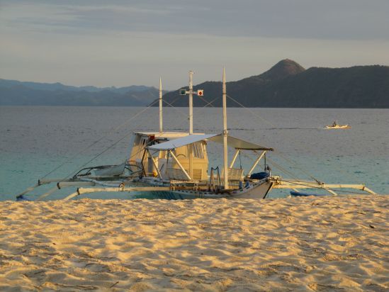 club paradise coron philippines transport boat sunset picture